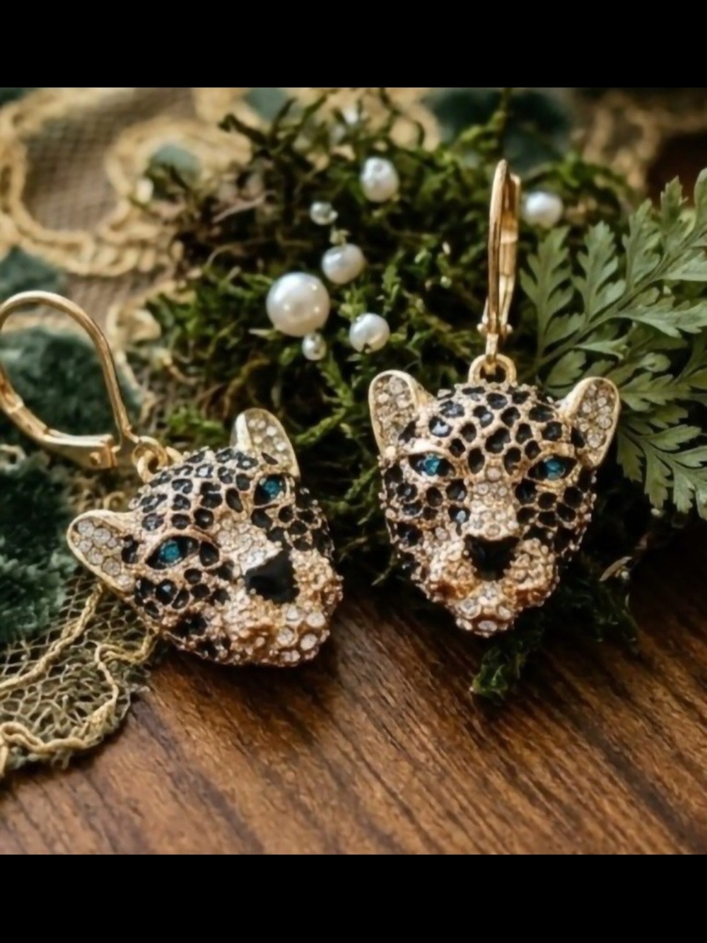 Gold-tone leopard (or panther) head drop earrings for women.